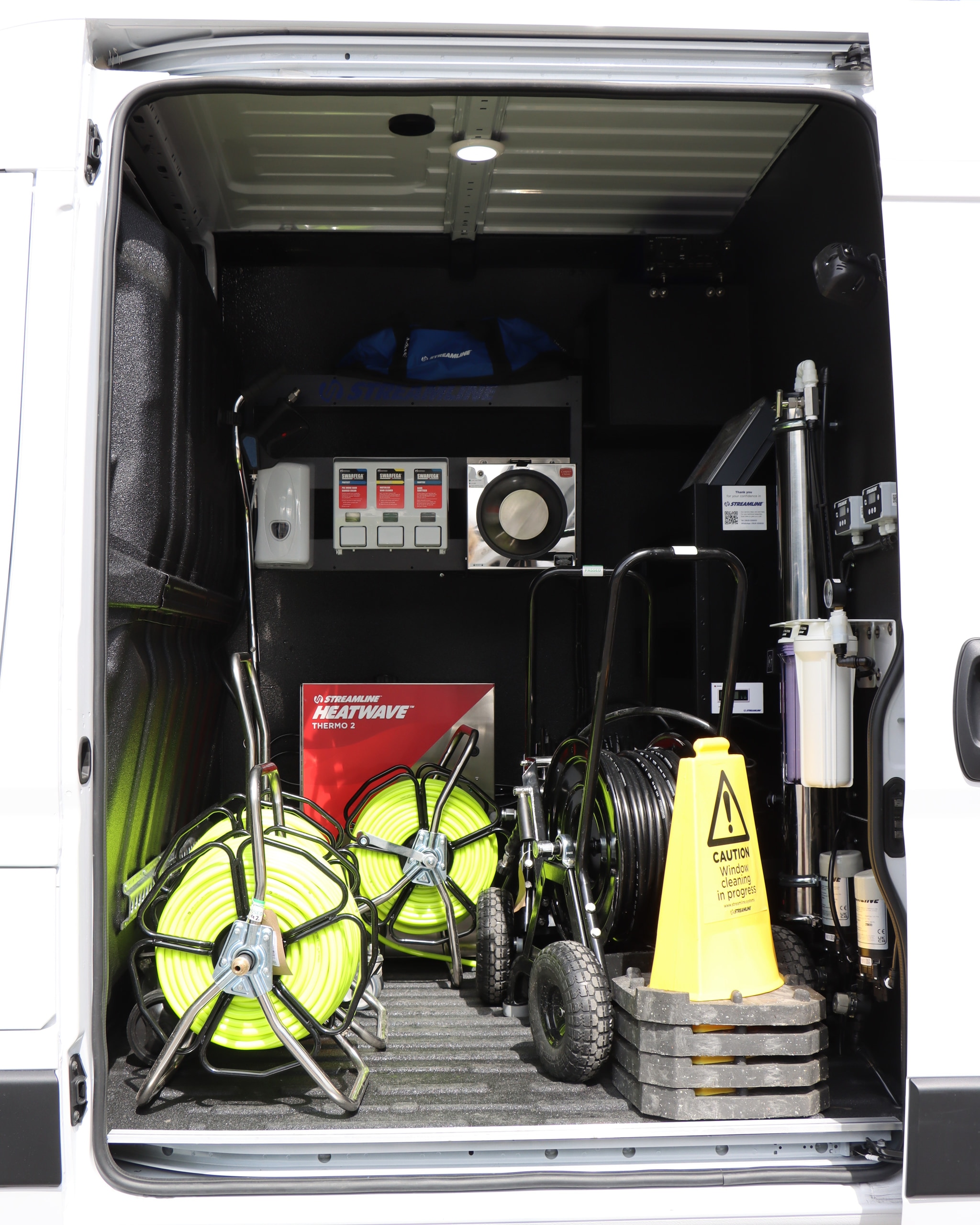 Rear van fitout with large water tank, pumps and carbon filters