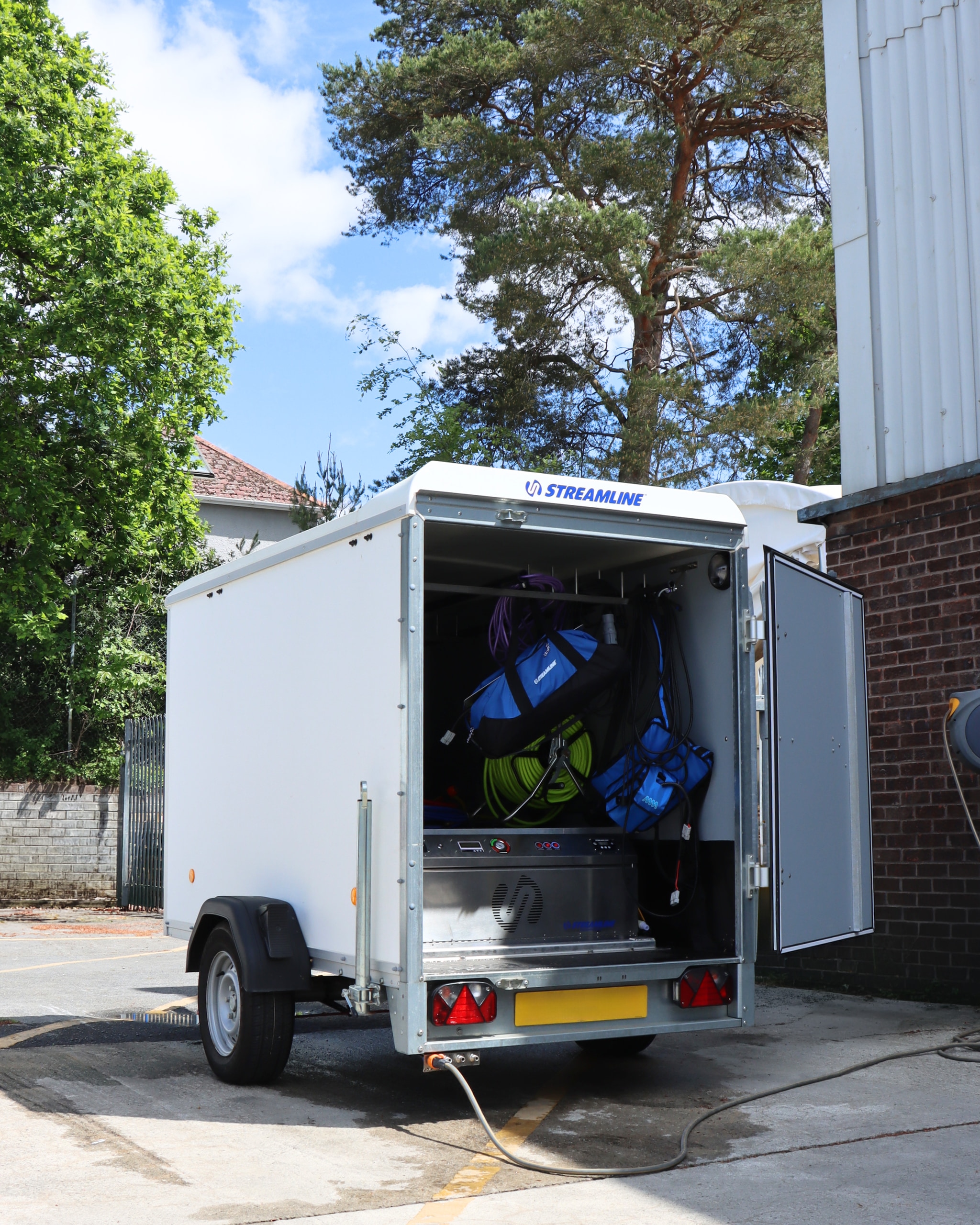 Streamline box trailer fitted for window cleaning with hose reels and bags